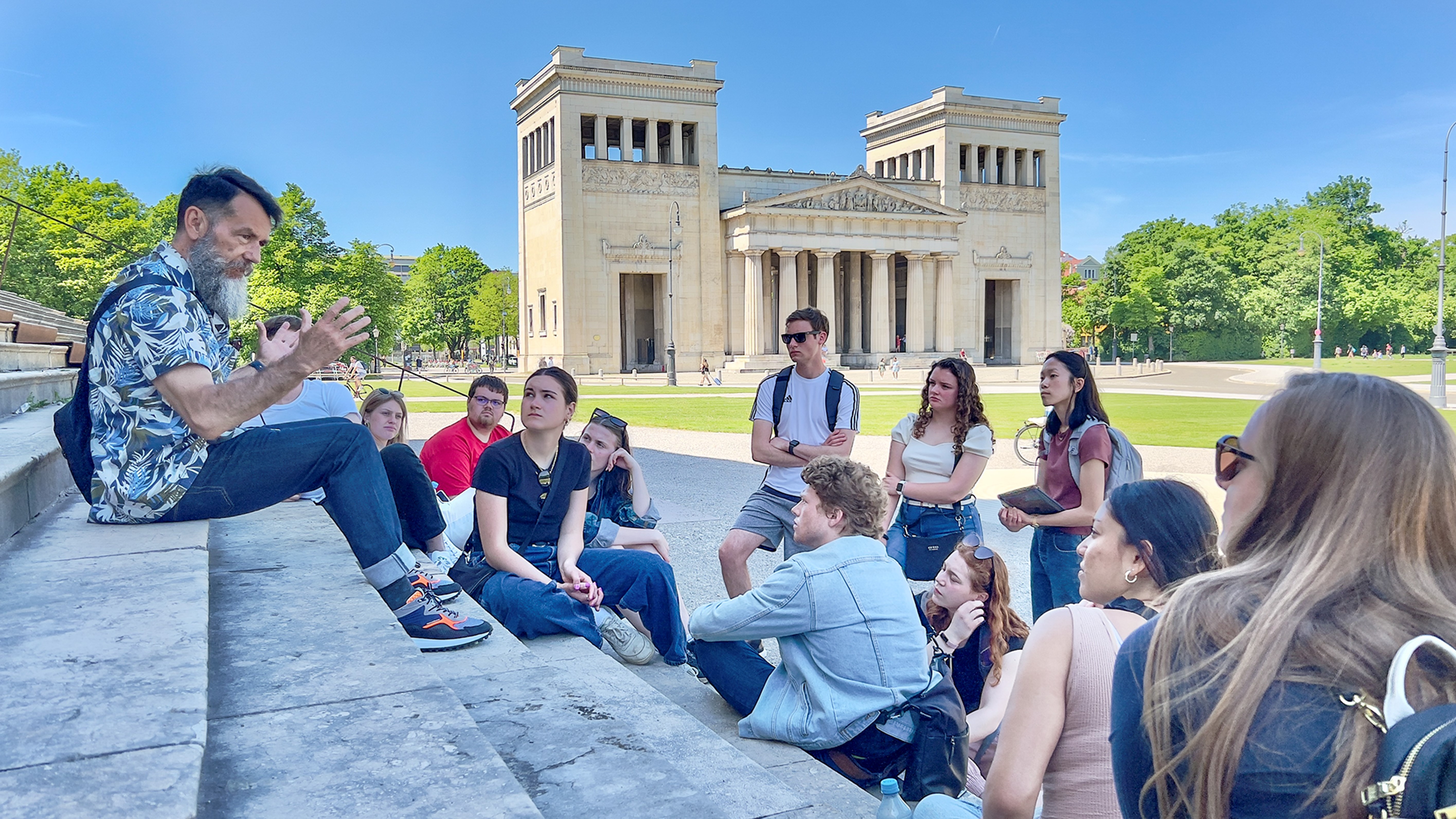 class learning while sitting outside on stairs