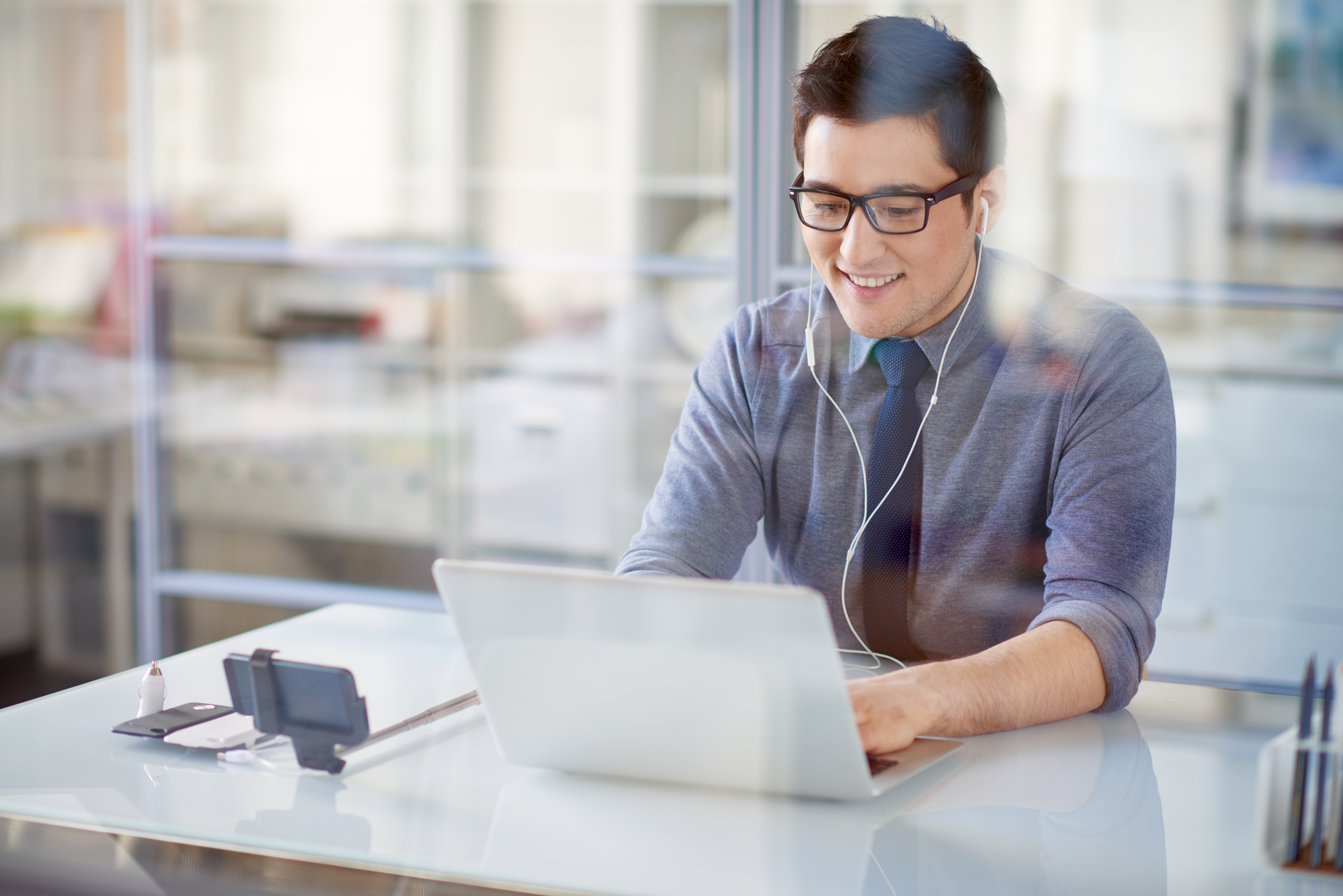 man using computer in office setting